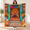 Bienvenidos a Casa blanket, held open