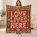Love Lives Here blanket, held open