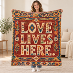 Love Lives Here blanket, held open