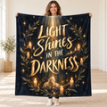 Light Shines in the Darkness blanket, held open