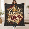 Grace Wins blanket, held open
