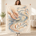 Surrender the Outcome blanket, held open