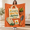 Live What You Believe blanket, held open