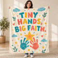 Tiny Hands, Big Faith. blanket, held open