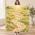 Follow Jesus, One Step at a Time. blanket, held open