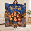 Kind Hearts Shine Bright. blanket, held open