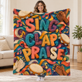 Sing, Clap, Praise. blanket, held open